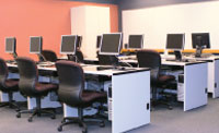 Computers desks and tables in lab room at ECC